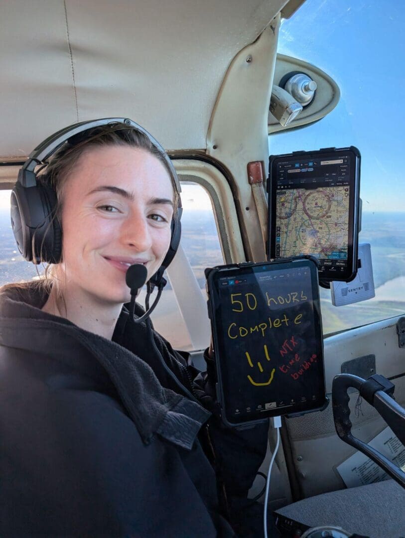 A person in the cockpit of an airplane.